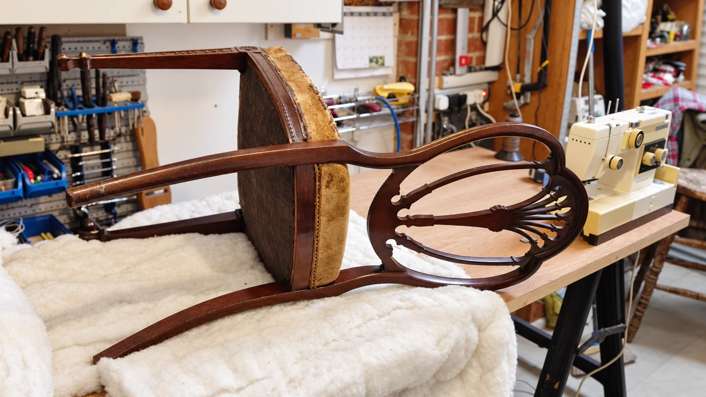 Furniture and upholstery materials inside John’s workshop.
